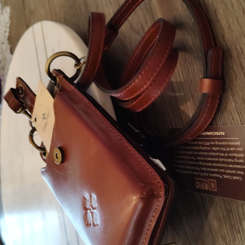 Telephone and card carrying case and purse with shoulder strap